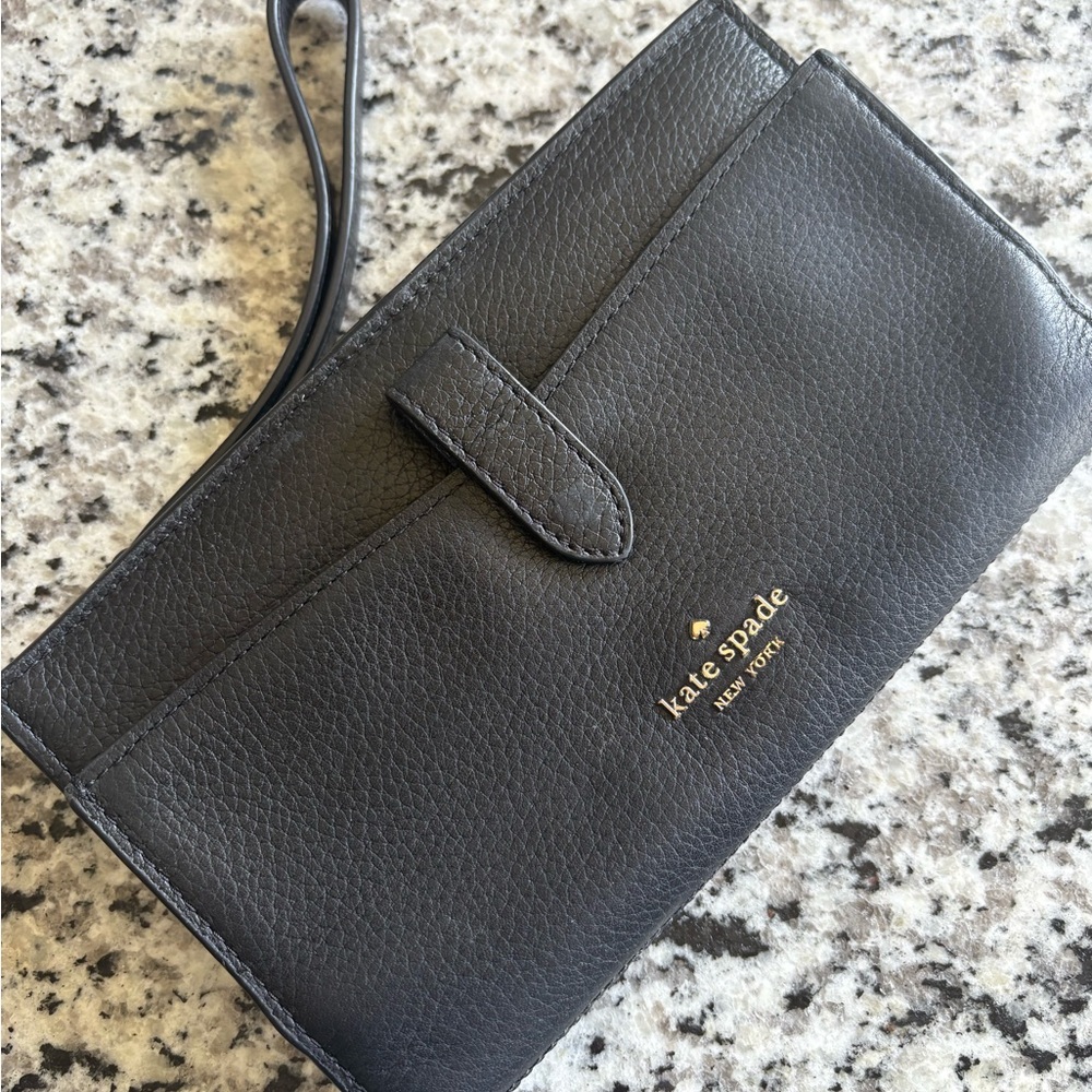 kate spade black pebbled leather wristlet with gold logo